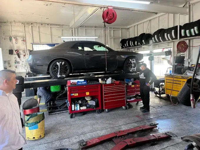Vehicle on a service lift at Velasco Auto Care Center
